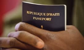 Close up of person's hands holding a passport