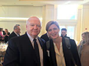 John Foley smiling for photo with Samantha Power 