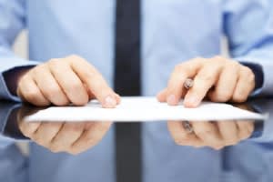 Attorney pointing out something on a document