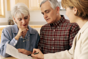Elderly Couple and a Woman Talking to One ANother
