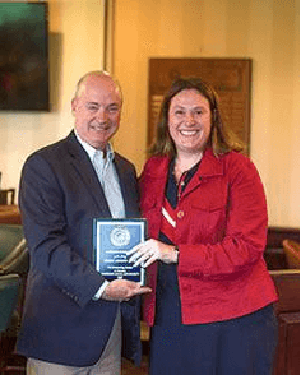 Patrick Cummings receives the Patriot Attorney Award from Amy Delaney of the Veteran's Legal Aid Society