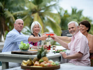 Senior group having a toast outside 