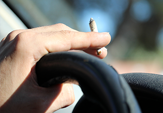 hand with marijuana while driving 