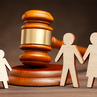 Mother and father apart from the child and judge's hammer