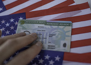 Green card on american flag background 