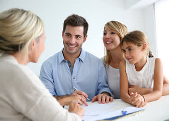 Two parents and their daughter discuss their estate plan with a laywer