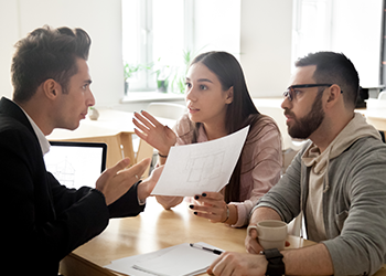 A couple argue with another person over a document 