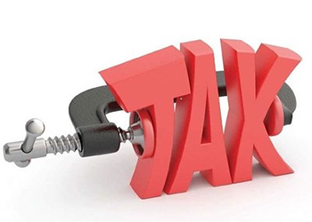 A clamp squeezes the word tax