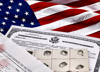 Immigration documents on an American flag