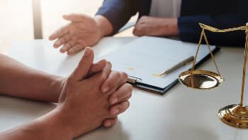 Lawyer speaking with a client