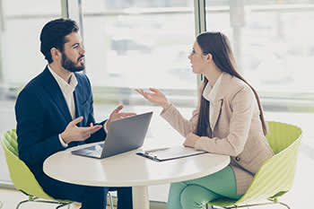 Man and woman arguing at a cafe