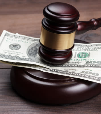 Gavel and Dollar bill on table
