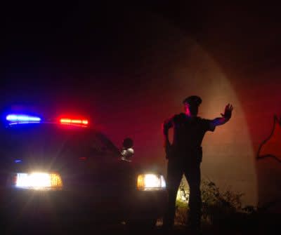 Police officer stopping traffic