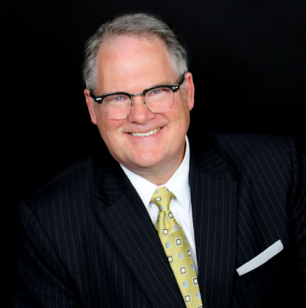 Attorney Tim sitting and smiling