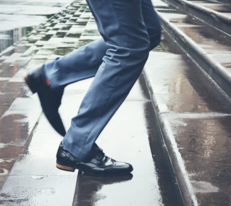 Man in Suit Going Up Stairs