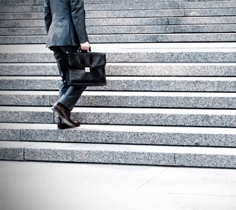 Man in Suit Going Up Stairs