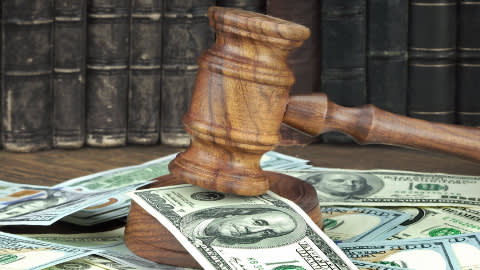 Gavel with a bunch of money