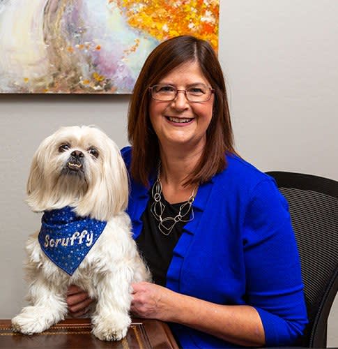 Attorney Theresa Seifert and Scruffy the dog