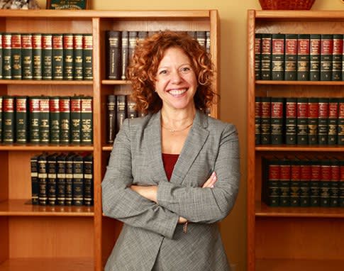 Attorney Jill M. Abrahamson Standing and Crossing Her Arms