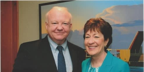 Foley posing with senator Susan Collis for a picture 