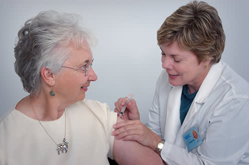 Woman getting a checkup from a doctor