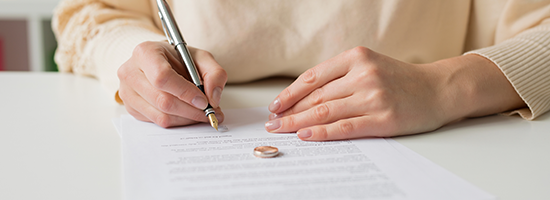 Women signing documents