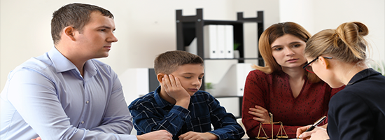 Divorced parents with their son visiting lawyer. Concept of child support