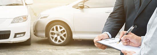 Filling out insurance information after an accident