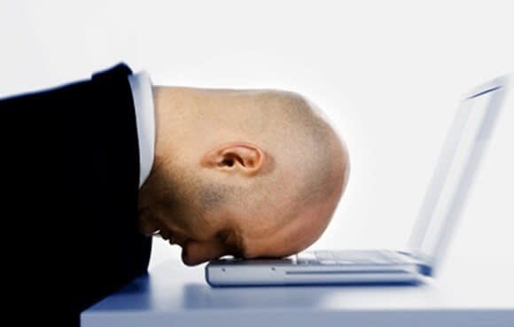 Man upset at laptop