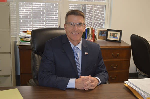 Attorney Dennis Hogan sitting at his desk