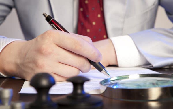 Attorney Writing at His Desk