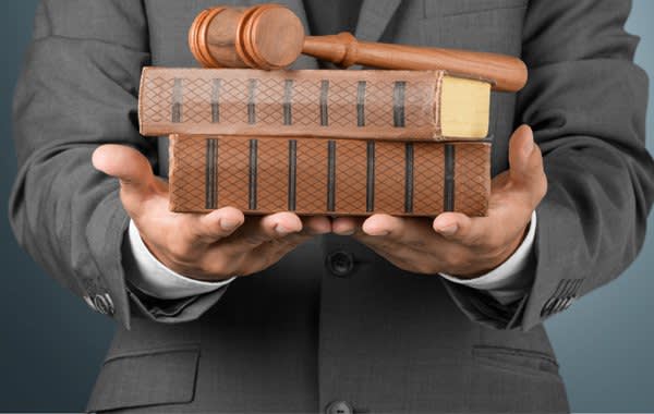 Man and Gavel and Law Books