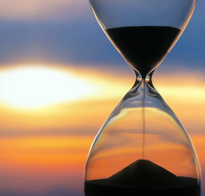 Hourglass with a sunset in the background