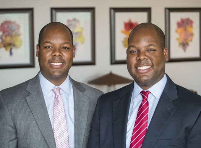 Attorneys Kevin and Keith smiling at the camera