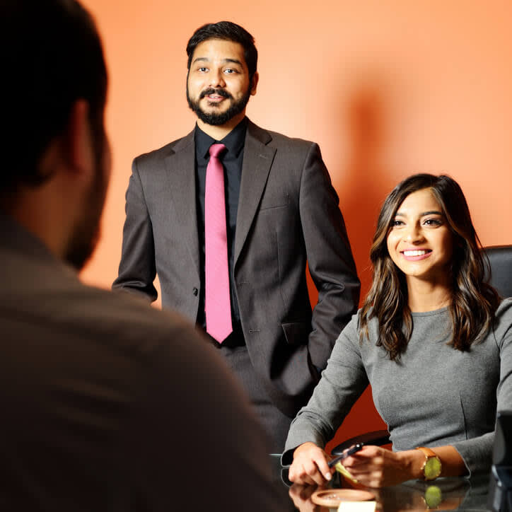 Karina Deochand and Romi Jayswal helping a client