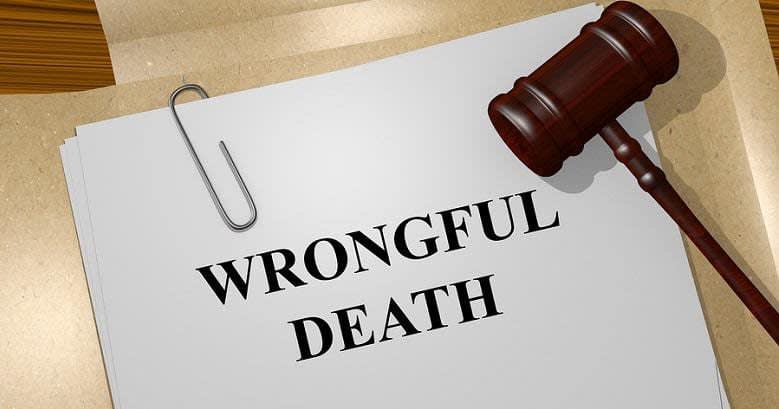 Wrongful death printed on paper with a paperclip and gavel