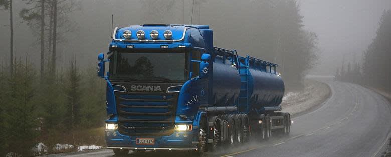 Tank truck driving in fog