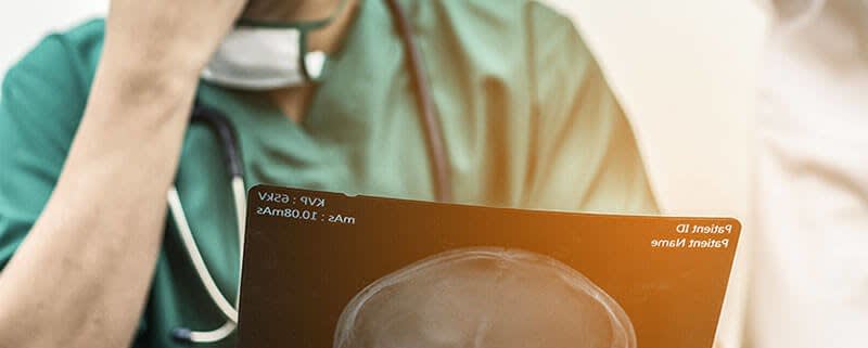 Doctor Looking at Radiograph