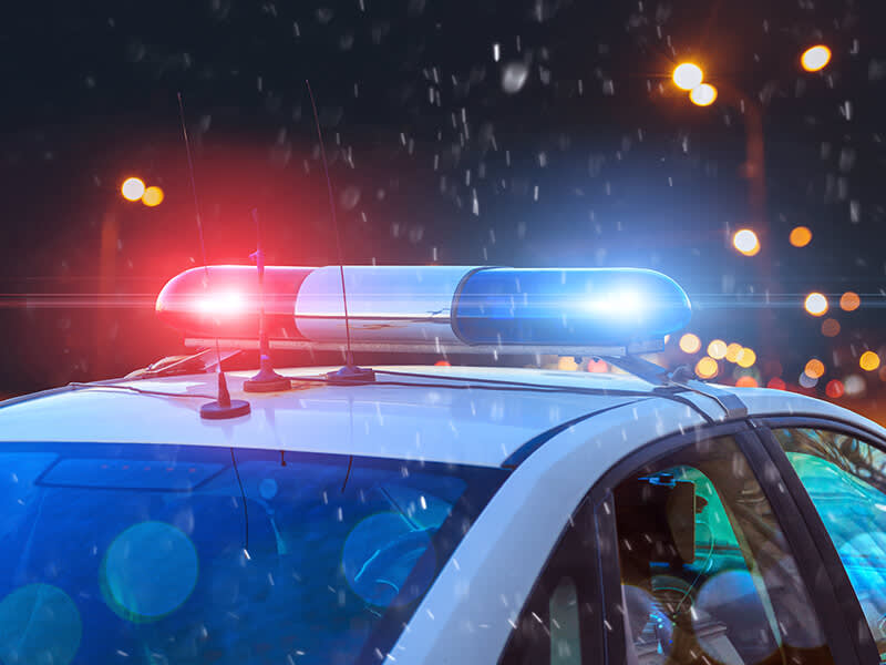 Police car with lights on at night
