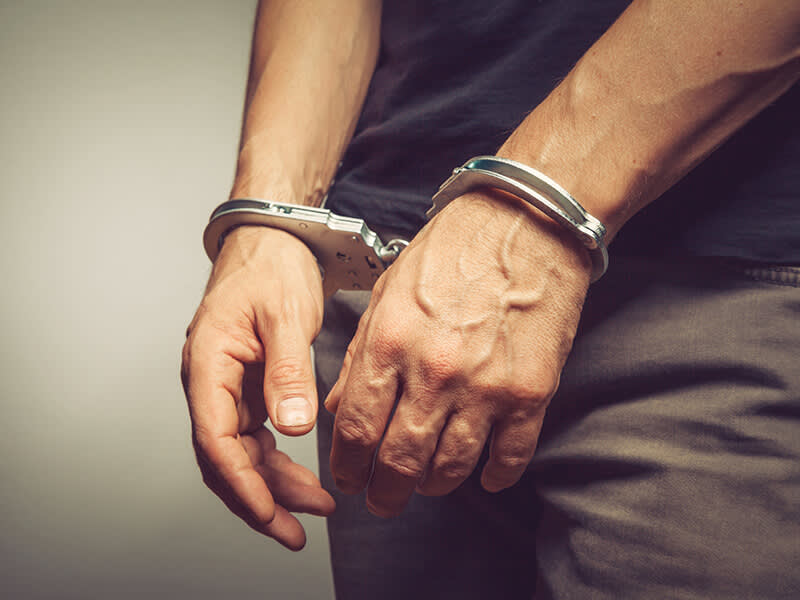 Hands in handcuffs