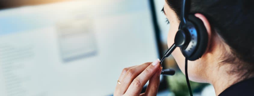 Woman Talking Through a Headphone.