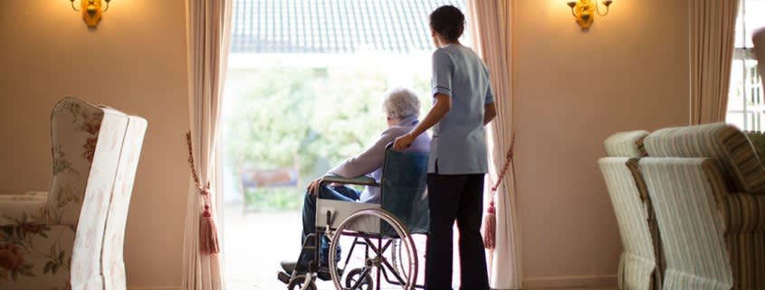 Woman Holding Wheelchair