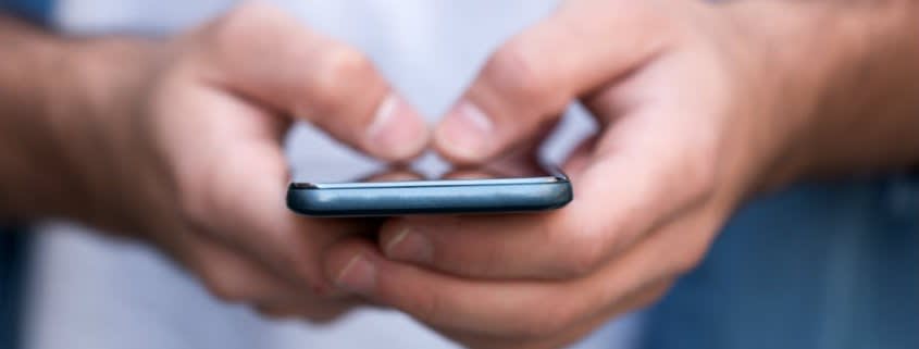 Man Touching a Cellphone