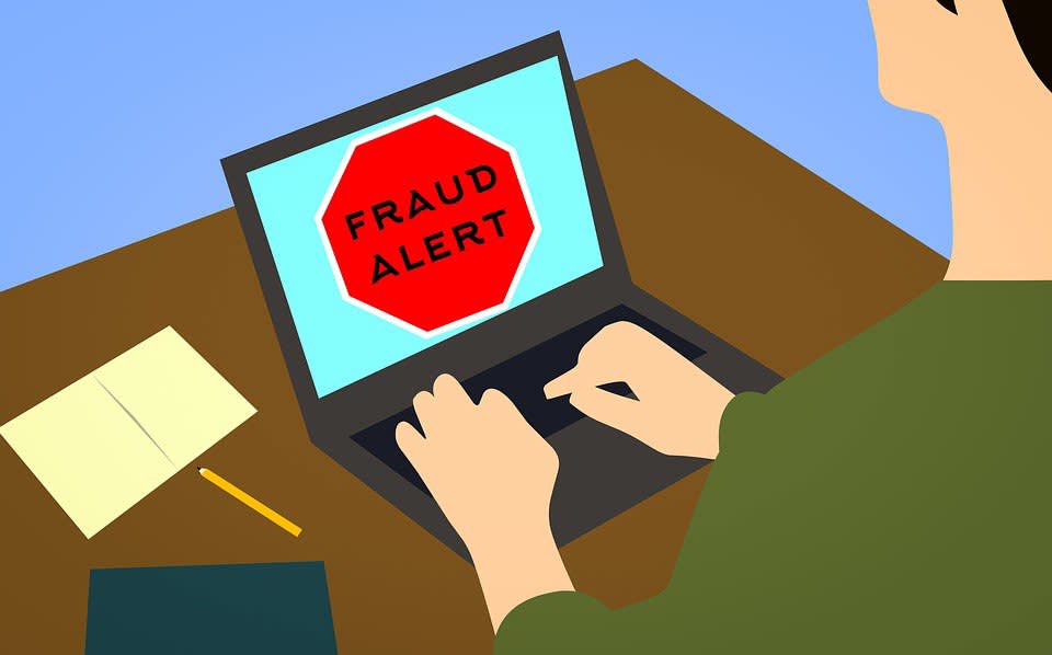 Fraud alert on laptop