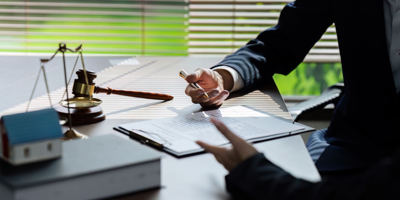 Businessman consulting attorney to draft contract