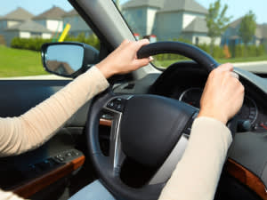 2 hands on the steering wheel while driving