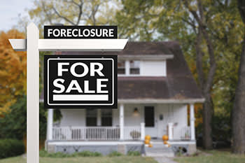 Foreclosure sign on for sale house