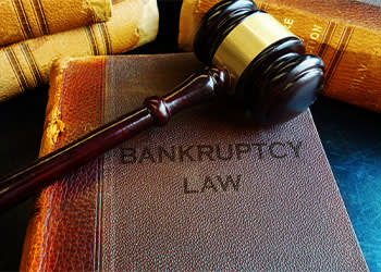 Bankruptcy Book with Gavel on Top 