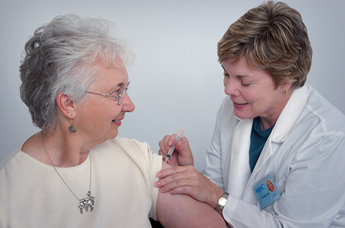 Woman getting a checkup from a doctor
