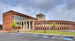 Large brick building with rounded facade